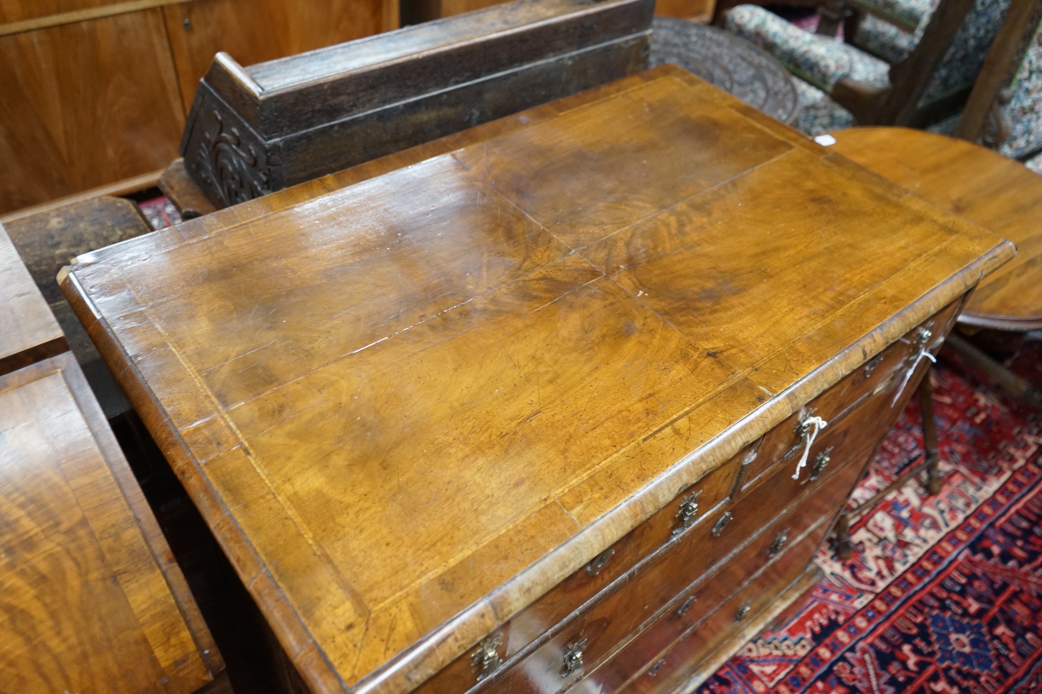 An 18th century feather banded walnut chest of two short and three long drawers, width 95cm, depth 58cm, height 92cm